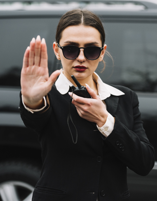 security-woman-stopping-photographers